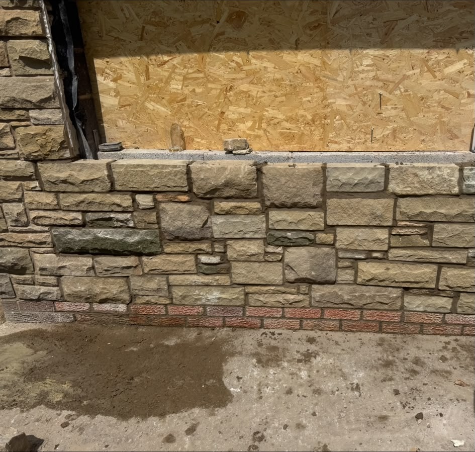Stone wall construction in progress